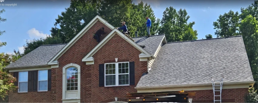 Drone aerial view of Annapolis Maryland home with new roof in residential neighborhood