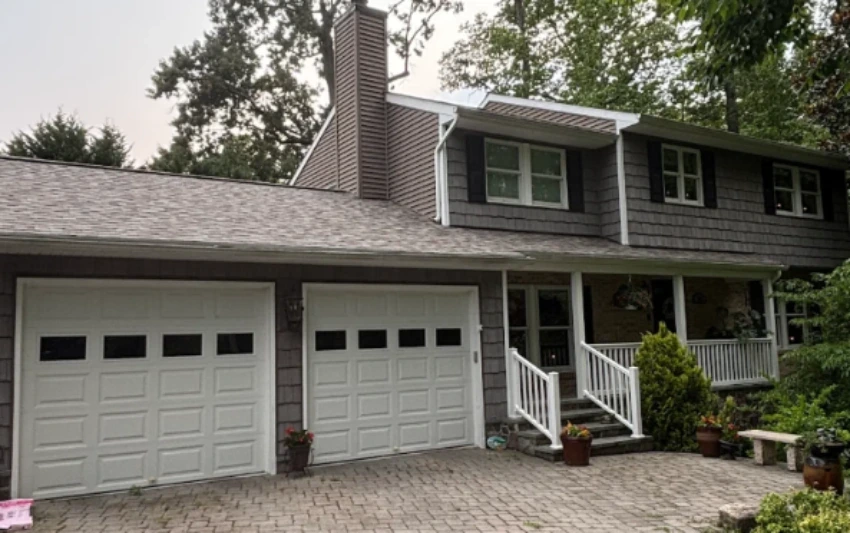 Drone aerial view of large Annapolis Maryland home roof for inspection